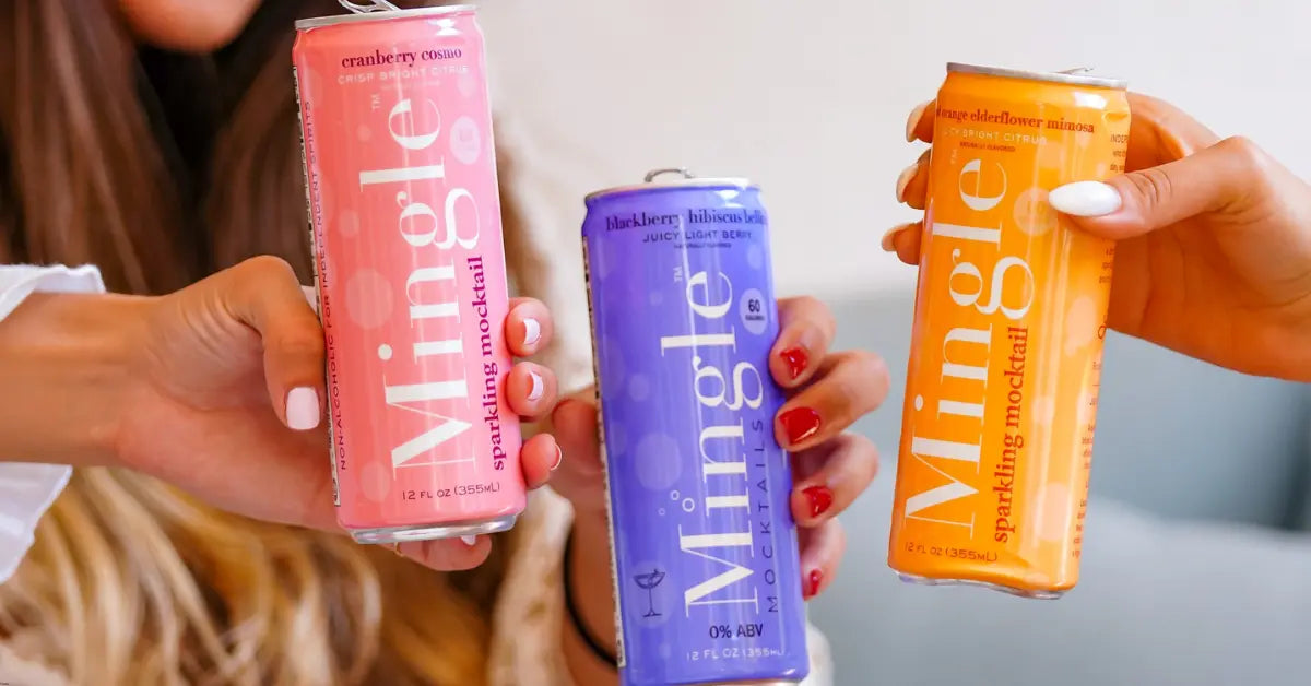 Non-alcoholic beverages in vibrant Mingle Mocktails cans held by friends in a cheerful gathering