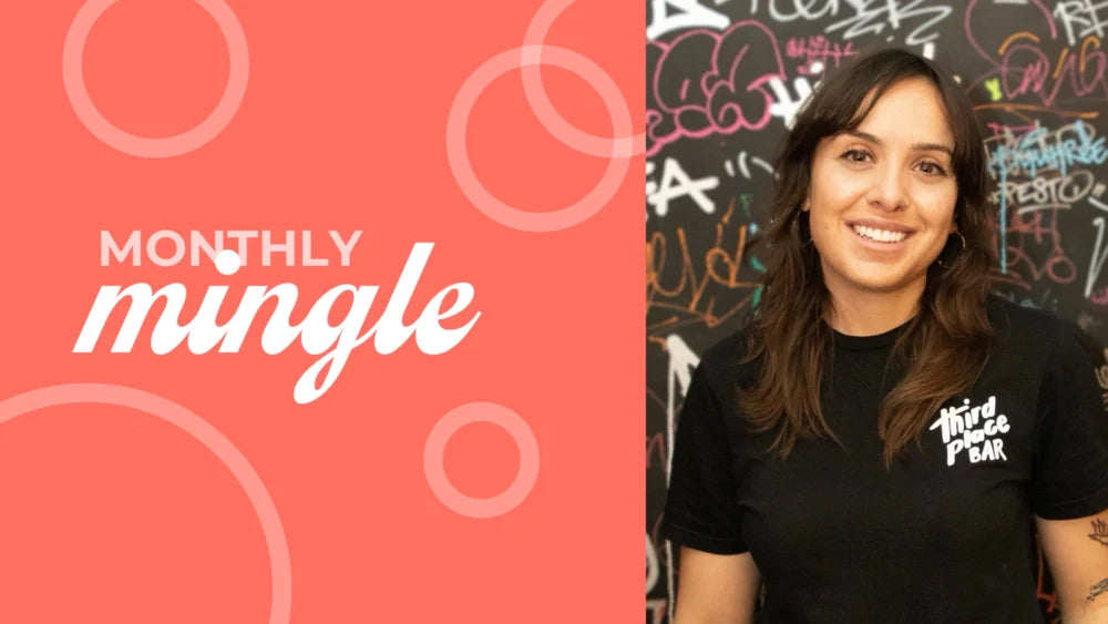 Third Place Bar founder smiling, wearing a branded black t-shirt, standing against a graffiti-covered wall next to a "Monthly Mingle" graphic on a coral background