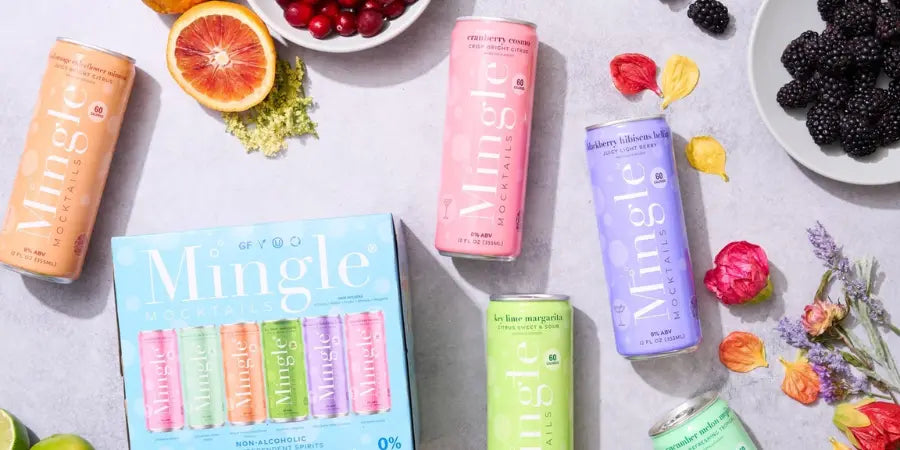 Healthy mocktails from Mingle displayed in a colorful assortment, surrounded by fresh fruits and floral accents.