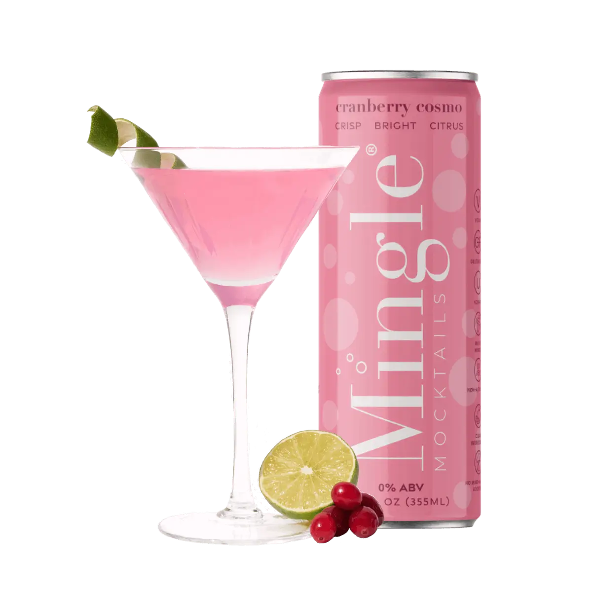Mingle Mocktails Cranberry Cosmo can next to a pink cocktail in a martini glass, garnished with a twisted lime wedge. Fresh cranberries and a sliced lime are placed at the base of the glass. The can is a bright pink with white text highlighting "crisp, bright, citrus" and "0% ABV" on the label. The scene is chic, refreshing, and vibrant.