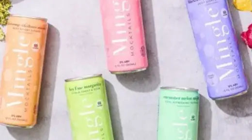 Canned mocktails in colorful packaging, including flavors like cucumber melon & key lime, displayed on a light background