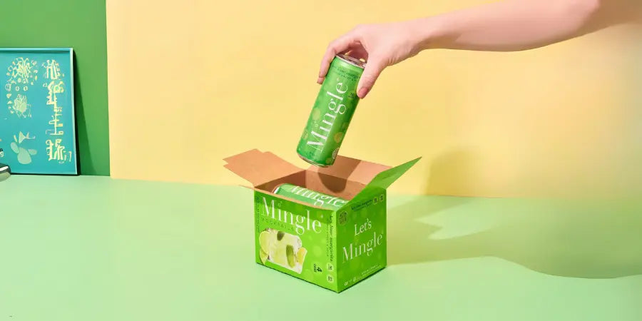 Gluten-free mocktails packed in a bright green Mingle box with a hand lifting a can.