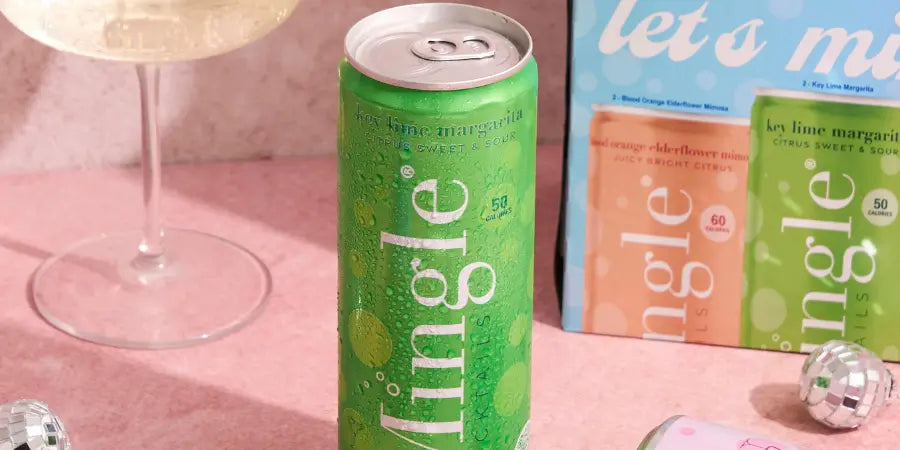 Kosher mocktails featuring Mingle’s key lime margarita can on display with festive decorations.