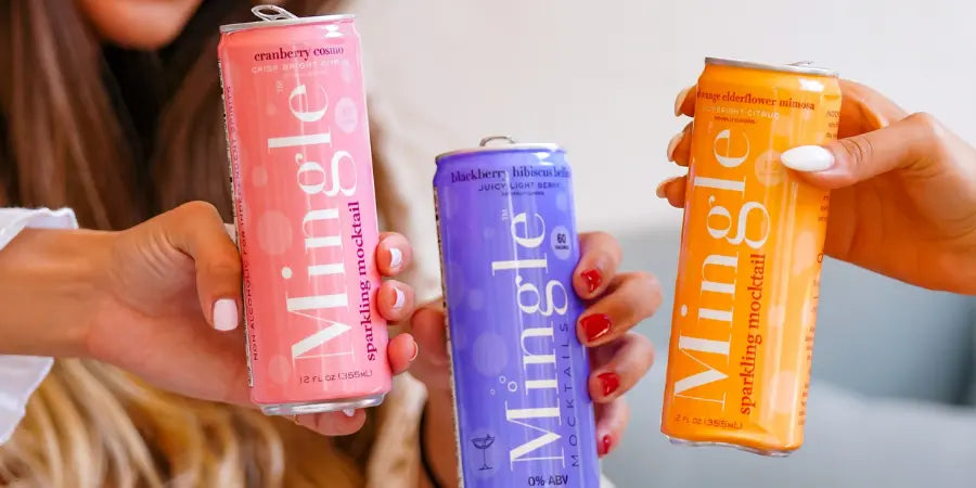 Non-alcoholic drink options with friends toasting Mingle sparkling mocktails in cranberry cosmo, blackberry hibiscus bellini, and elderflower mimosa flavors