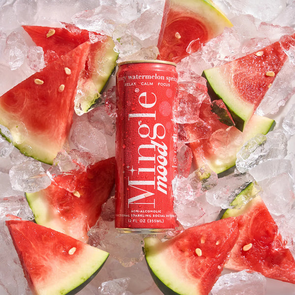 Red Mingle Mood Juicy Watermelon Spritz can chilled on ice with fresh watermelon wedges.