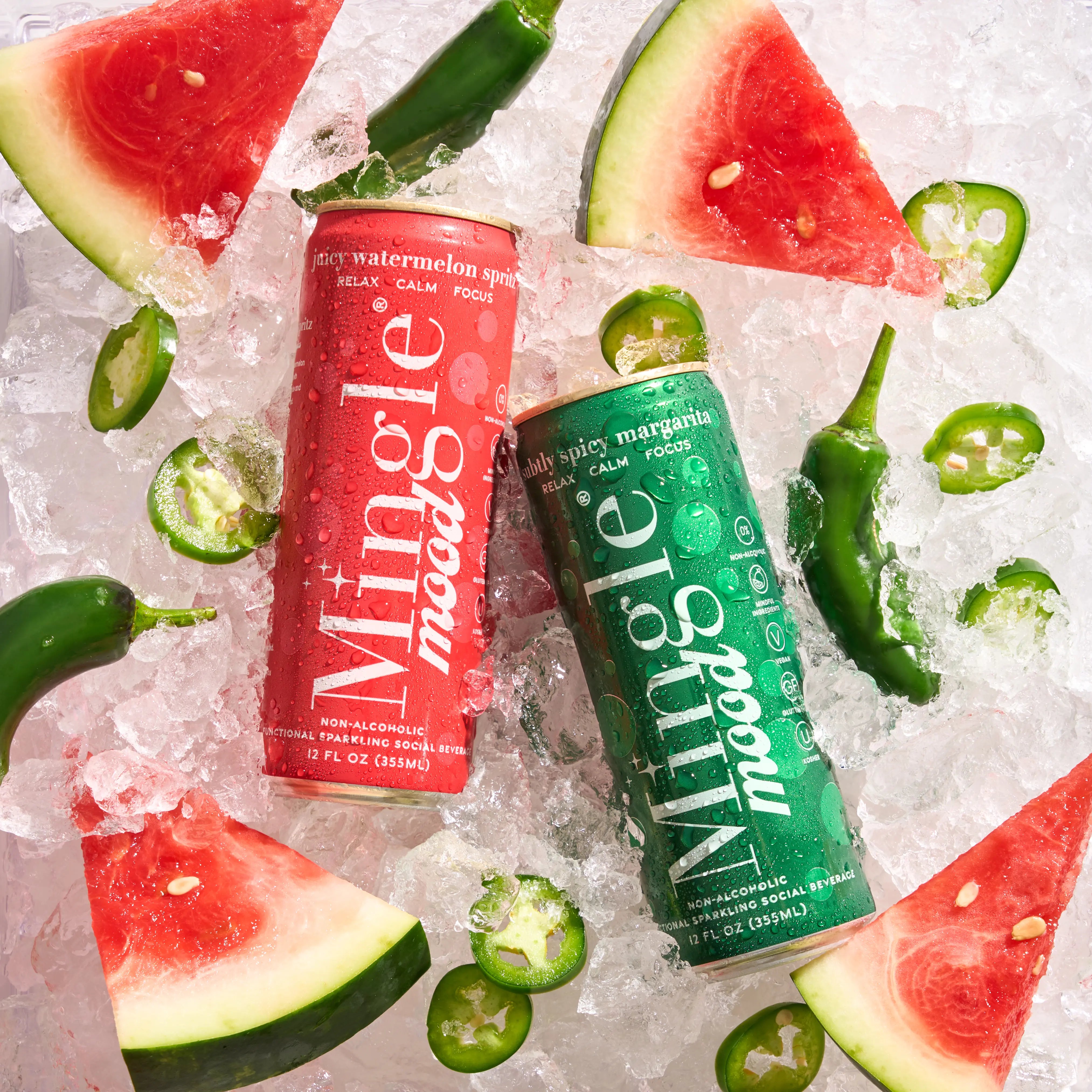 Mingle Mood watermelon spritz and spicy margarita cans chilling on ice with jalapeños and melon slices.