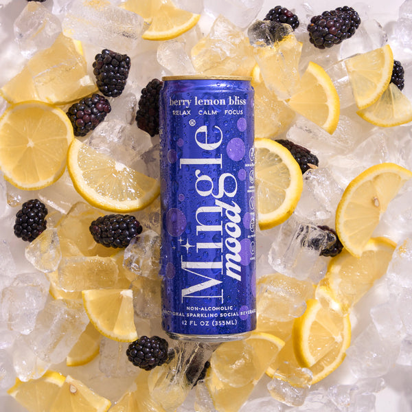 Mingle Mocktails berry lemon bliss can surrounded by ice, lemon slices and blackberries