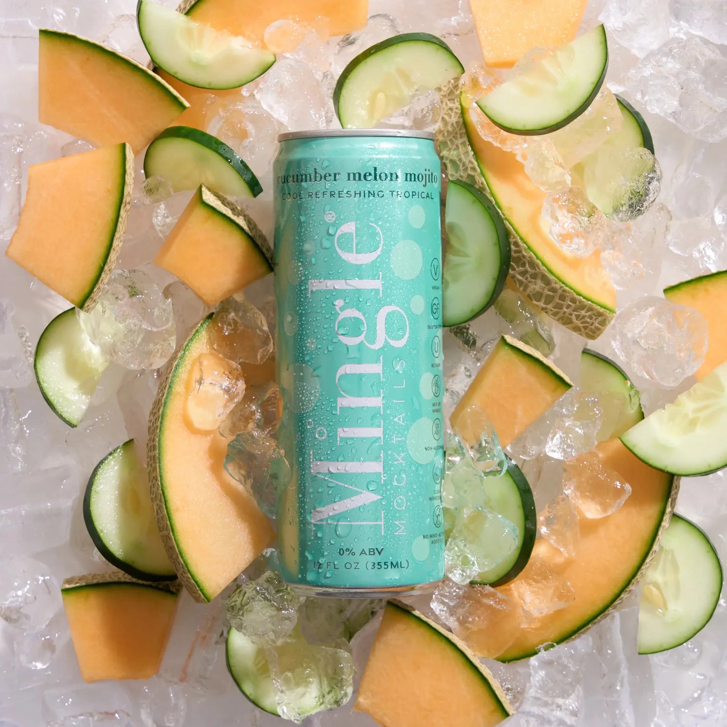 Mingle Mocktails Cucumber Melon Mojito can in turquoise surrounded by fresh cantaloupe slices, cucumber rounds, and crushed ice.